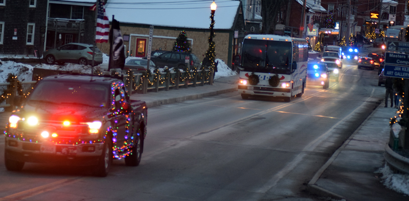 The Wreaths Across America convoy crosses the Damariscotta-Newcastle bridge on its way to Lincoln Academy on Sunday, Dec. 8. The convoy was more than 6 miles long when it left Columbia Falls on its way to Arlington National Cemetery. (Evan Houk photo)
