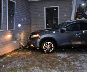 A Nissan SUV struck the front of 25 Washington Road in Waldoboro, a building that houses the Golden Wok Chinese restaurant and Cigaret Shopper, Tuesday, Dec. 17. (Alexander Violo photo)