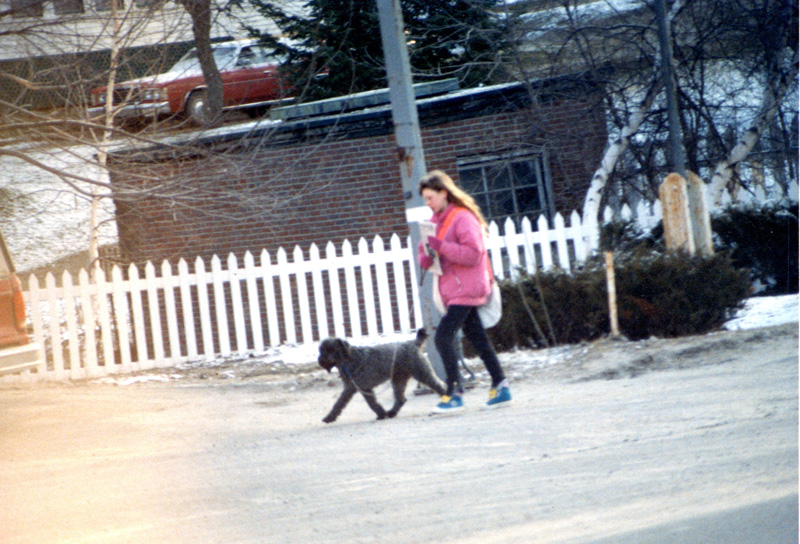 The author at about age 13 walking with her neighbor's dog to deliver newspapers. (Photo courtesy Sarah Caton)