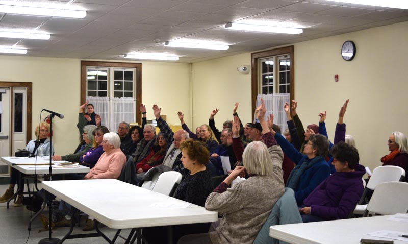 Dresden residents vote to appropriate $50,000 from surplus to buy 540 Gardiner Road during a special town meeting at Pownalborough Hall on Wednesday, Jan. 15. (Jessica Clifford photo)