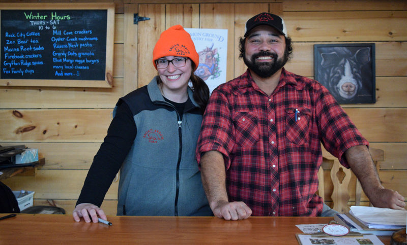 Kelly Dunbar, a Broad Arrow Farm employee who manages the Suppah Club, stands next to Omen Viele, the chef who prepares the food for the program. (Jessica Clifford photo)