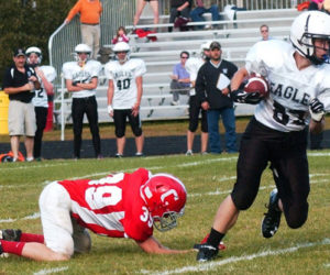 Mason St. Louis escapes a tackle in Lincoln County Football action at Cony in 2014. The nonprofit Lincoln County Football program will cease operations afer 19 years. (LCN file photo)