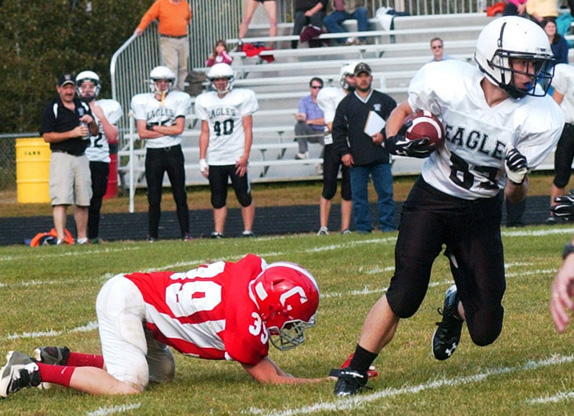 Mason St. Louis escapes a tackle in Lincoln County Football action at Cony in 2014. The nonprofit Lincoln County Football program will cease operations afer 19 years. (LCN file photo)