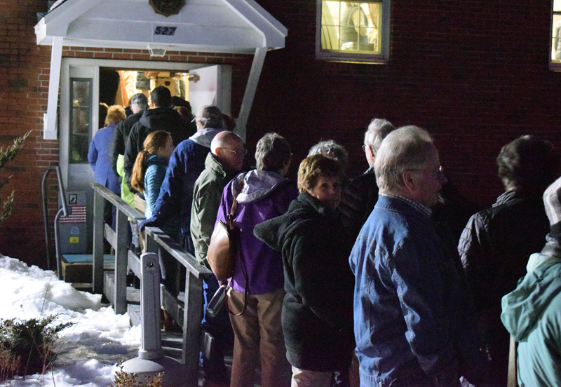 People wait outside the Wells-Hussey American Legion Post in Damariscotta to enter for an event with Sara Gideon, Democratic candidate for U.S. Senate. (Evan Houk photo)