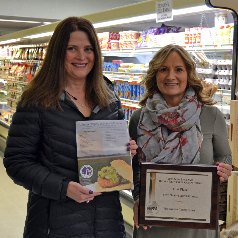 From left: Julie Greenleaf, advertising representative for The Lincoln County News, holds an award-winning advertisement for Main Street Grocery while Main Street Grocery owner Jane Gravel holds the award. The LCN won first place for native advertising in the New England Newspaper and Press Association Better Newspaper Contest. The winning advertisement was a featured recipe page in Lincoln County Magazine.