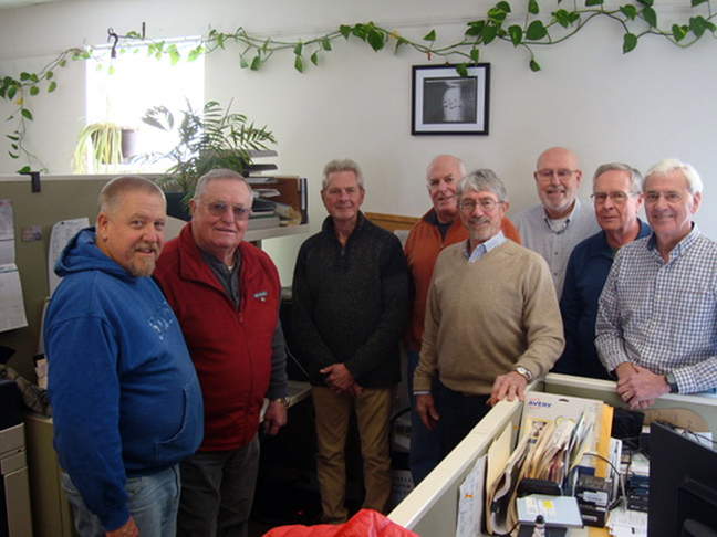 From left: Lincoln County Sheriff Todd Brackett meets with members of a local men's group, Dick Mayer, Rick Hagen, Bruce Lutsk, Ted Silar, Doug Cameron, Bill Coyne, and Wayne Moore. The group bought and donated software and hardware necessary for the RUOK program, which facilitates daily welfare checks on those in need. (Jessica Clifford photo)