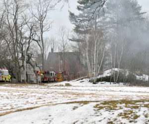Smoke rises from a kitchen fire at a home in Newcastle's Sheepscot village the afternoon of Wednesday, Feb. 26. The fire was quickly knocked down, according to Newcastle Deputy Fire Chief Casey Stevens. (Evan Houk photo)