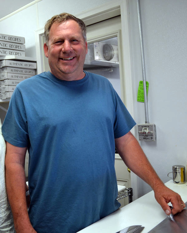 Gregory Lemar, then-owner of the Dresden Take Out, attends the grand reopening of the business in June 2014. Lemar, of Wiscasset, the longtime owner of Greg's Used Cars & Service Inc., died in a snowmobile crash Sunday, Feb. 23. (Charlotte Boynton photo, LCN file)