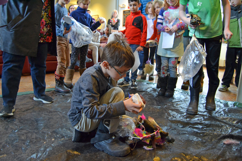 Tristan Greenleaf, 8, of Bristol, checks to see if his egg survived the drop. (Maia Zewert photo)