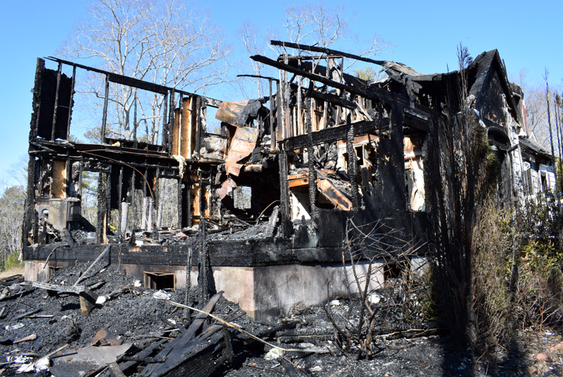 The remains of a house at 30 Sunny Acres Lane in Boothbay after a fire early Thursday, March 5. (Evan Houk photo)