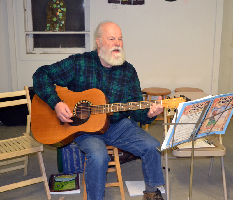 Dan Townsend leads the monthly community singing circle at Sheepscot General in Whitefield on the evening of Saturday, Feb. 29. (Christine LaPado-Breglia photo)