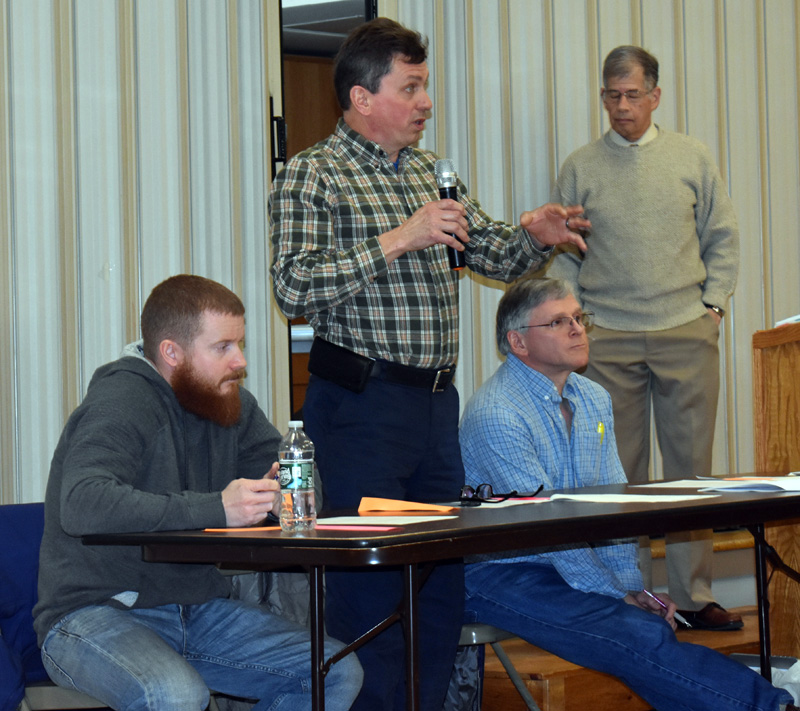 Somerville Second Selectman Don Chase speaks during a special town meeting Saturday, March 7, as Third Selectman Jarad Greeley (left) and First Selectman Chris Johnson look on. (Alexander Violo photo)