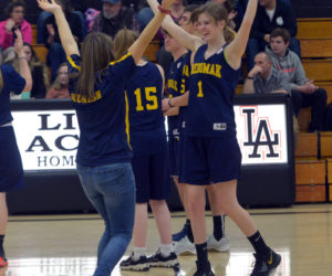 Medomak Valley Unified coach Emma Kunesh and Michaela Staples dance to "Y.M.C.A." at halftime of their game at Lincoln Academy. (Paula Roberts photo)