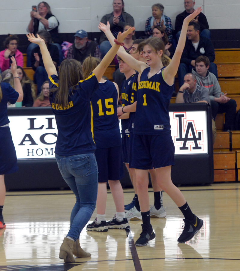 Medomak Valley Unified coach Emma Kunesh and Michaela Staples dance to "Y.M.C.A." at halftime of their game at Lincoln Academy. (Paula Roberts photo)
