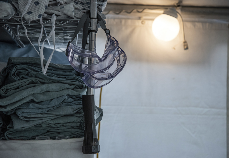 Goggles and gowns fill a supply shelf in the triage tent on LincolnHealth's Miles Campus in Damariscotta on Monday, March 30. The tent stands in front of the entrance to the emergency room. (Bisi Cameron Yee photo)