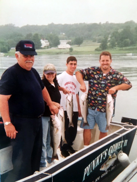 From left: Steve Fenton, Monika Martin, John Martin, and Joel Martin pose with their catch after a fishing trip on the Damariscotta River. (Photo courtesy Joel Martin)
