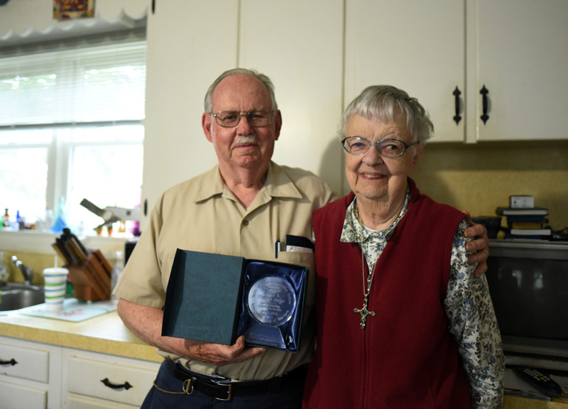 "Damariscotta History" columnists Calvin and Marjorie Dodge pose with an award for outstanding community service in their Damariscotta home June 15, 2018. Marjorie Dodge passed away early Monday, April 27. (Jessica Picard photo, LCN file)