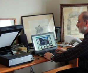 Collections manager Chuck Rand works on creating searchable computer records for the Old Bristol Historical Society's Digital Images Archive. Records that have been scanned into the archive will be available online through a link from the society's website.