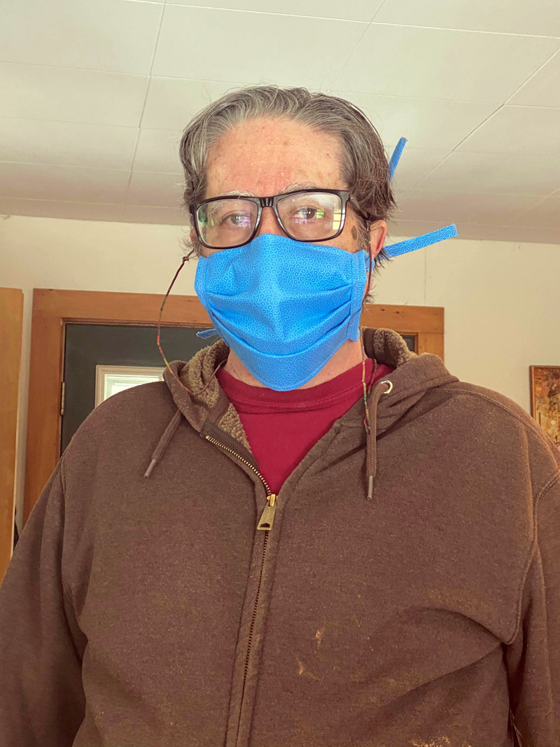 William "Zev" Keisch, of Damariscotta, wears one of the hand-sewn, medical-grade face masks he and a team of volunteers are making and distributing to essential workers in Lincoln County. (Photo courtesy Zev Keisch)