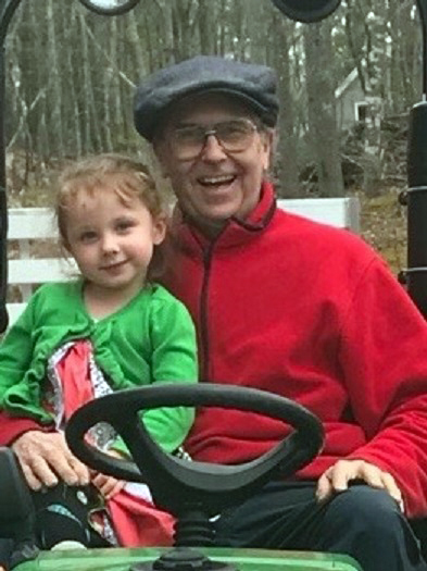 John Underwood with his granddaughter, Amira. Underwood died April 9 while assisting at an emergency scene near his home on River Road in Edgecomb.