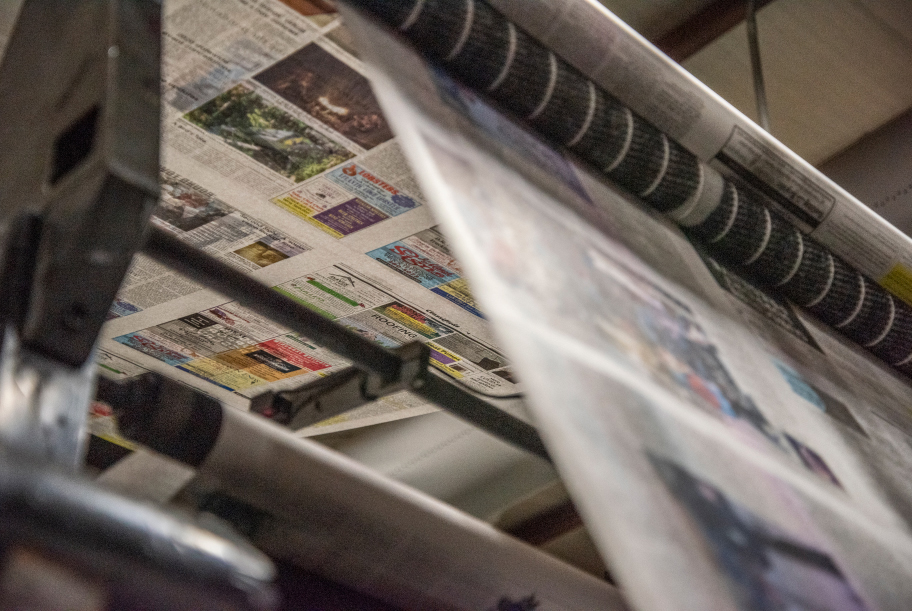 The Lincoln County News works its way through the press in Newcastle on May 6. (Bisi Cameron Yee photo)