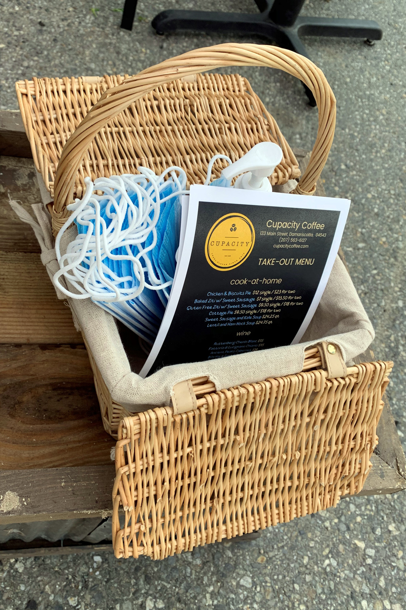 Cupacity offers free masks and hand sanitizer to customers using its outdoor tables during the open-air market Saturday, June 13. (Alyce McFadden photo)