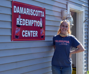 Damariscotta Redemption Center owner Caitlyn Butler stands in front of the center, behind Hilltop Stop in Damariscotta. The center is open from 9 a.m. to 5 p.m. Tuesday-Saturday. (Evan Houk photo)