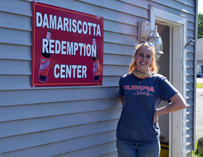 Damariscotta Redemption Center owner Caitlyn Butler stands in front of the center, behind Hilltop Stop in Damariscotta. The center is open from 9 a.m. to 5 p.m. Tuesday-Saturday. (Evan Houk photo)
