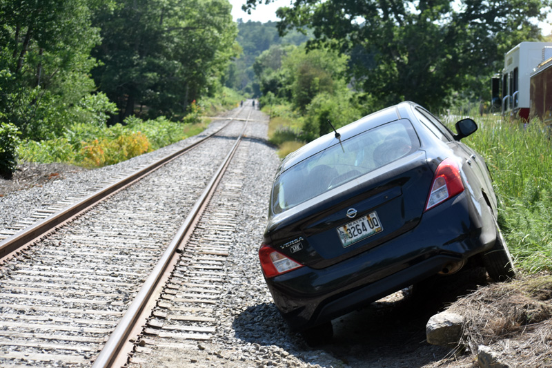 A Nissan Versa along the railroad tracks in Nobleboro after a crash, Tuesday, June 23. (Alexander Violo photo)