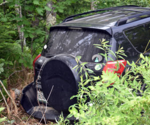 A Toyota RAV4 in the woods off of Route 1 in Waldoboro after a collision, Tuesday, June 23. (Alexander Violo photo)