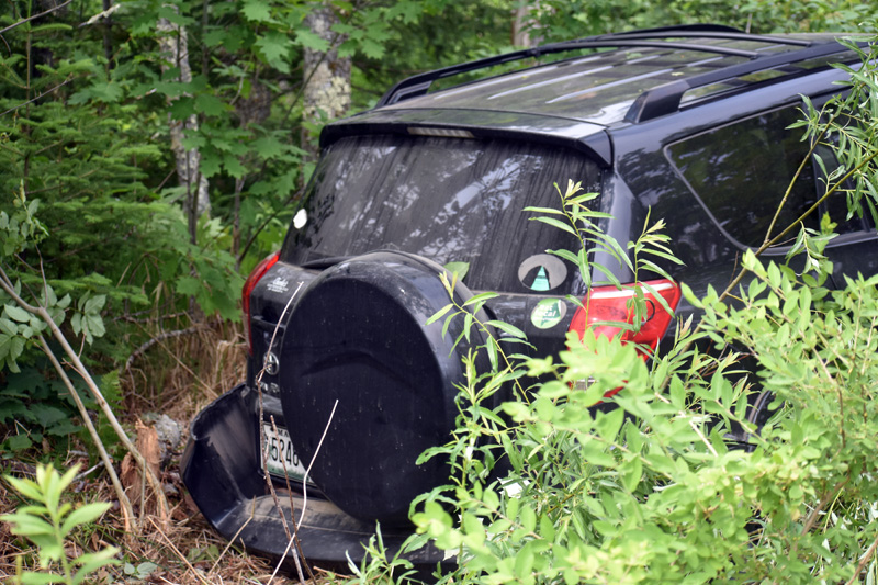 A Toyota RAV4 in the woods off of Route 1 in Waldoboro after a collision, Tuesday, June 23. (Alexander Violo photo)