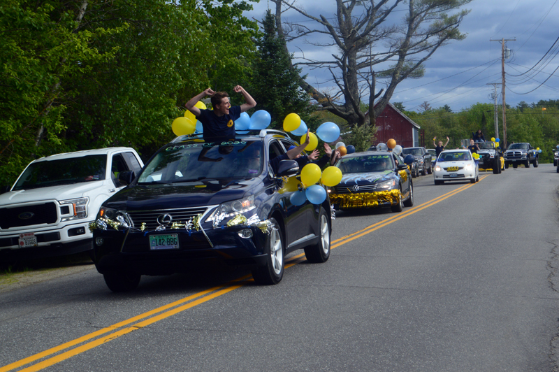 A soon-to-be graduate of Medomak Valley High School cheers from the moonroof of a vehicle during a motorcade Sunday, June 7. (Alyce McFadden photo)