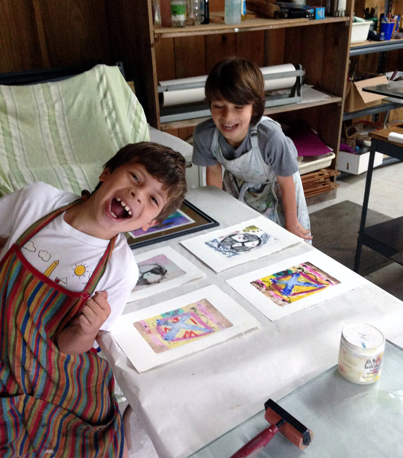 Two students of Midcoast Printmakers enjoy their time in the studio.