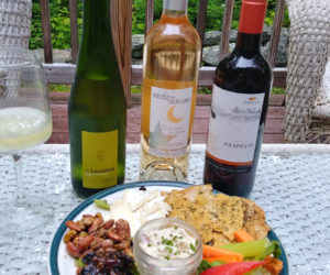 The three varieties of wine -- one white, one rose, and one red -- for the Damariscotta River Grill's inaugural virtual wine tasting, "Sip of Summer," along with a build-your-own plank with house-made crackers, crudite, Maison de Chevre Brie, spiced nuts, fig chutney, and smoked trout pate from the restaurant. (Photo courtesy Maia Gosselin)