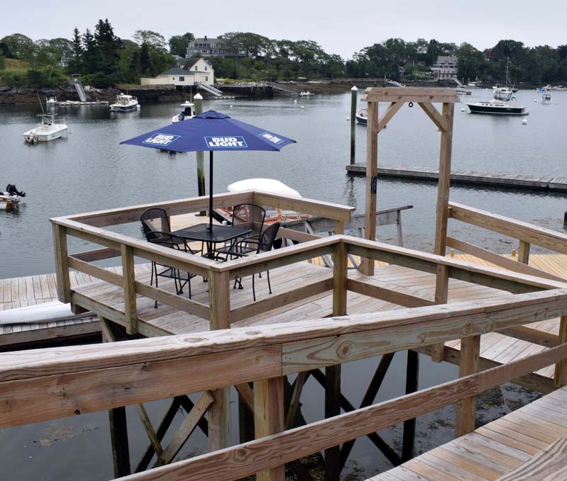 The bistro deck at Coveside Restaurant and Marina in South Bristol offers customers a secluded eating area overlookiing Christmas Cove. Coveside is open Thursday-Saturday from 11:30 a.m. to 9 p.m. (Evan Houk photo)