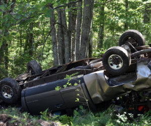 A Chevrolet pickup rests upside down off Route 17 in Somerville on Monday, July 20. The driver was taken to MaineGeneral Medical Center in Augusta, according to a sheriff's deputy. (Alexander Violo photo)