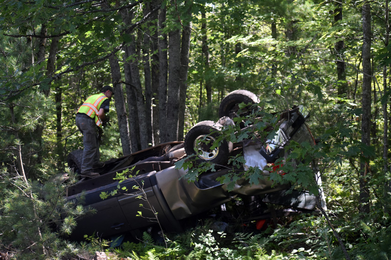 An overturned pickup is secured prior to its removal from an area off Route 17 in Somerville, Monday, July 20. (Alexander Violo photo)