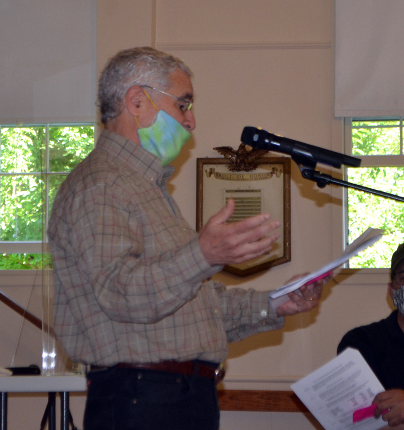 North End Road resident Ralph Jacobs addresses the Westport Island town meeting in the historic town hall, Thursday, July 18. (Charlotte Boynton photo)