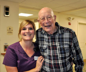 Kacie Gallant and a Lincoln Home resident share smiles during the day.