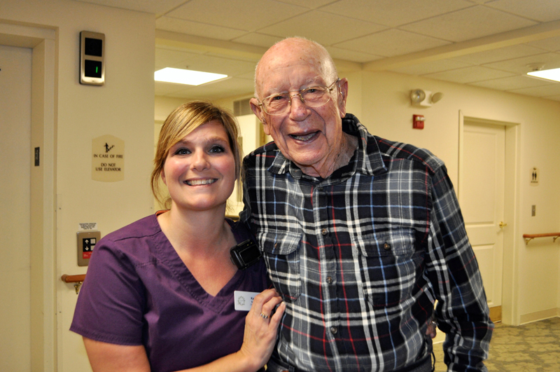 Kacie Gallant and a Lincoln Home resident share smiles during the day.