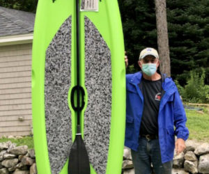 Rotary Vice President Bill Vaughan and the Lifetime Freestyle XL 9'8' paddleboard and paddle being raffled