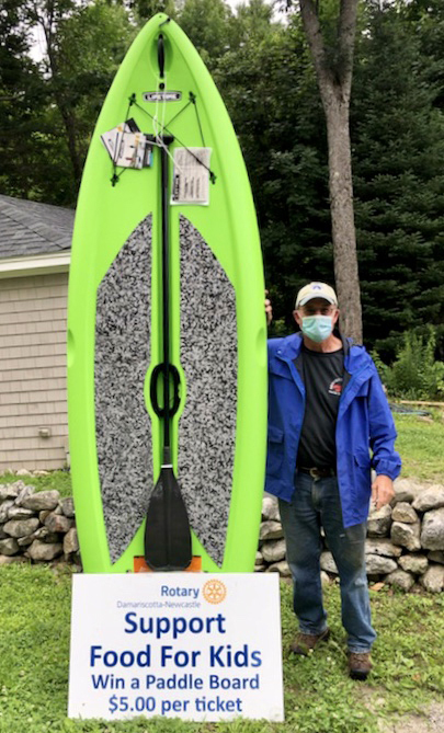 Rotary Vice President Bill Vaughan and the Lifetime Freestyle XL 9'8' paddleboard and paddle being raffled