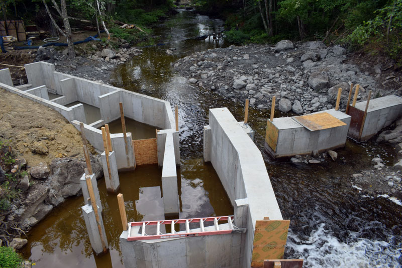The entrance to the new pool-and-weir fish ladder below the Bristol Mills Dam on Monday, Aug. 10. Mark Becker, of Nobleboro's Becker Construction Inc., said the ladder will be complete by the beginning of winter. (Evan Houk photo)