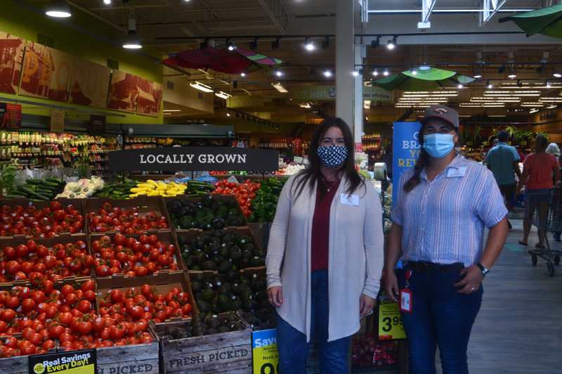 Store Manager Melissa Zayac and Retail Management Trainee Maria Nappi pose in the stores produce section. Along with the stores other leaders, Nappi and Zayac have guided the staff through uncertain times this spring. (Alyce McFadden photo)