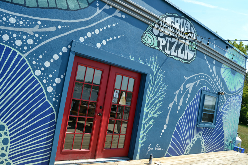 Artist Jenny Arter recently completed an abstract mural at Oysterhead Pizza Co. in downtown Damariscotta. (Maia Zewert photo)