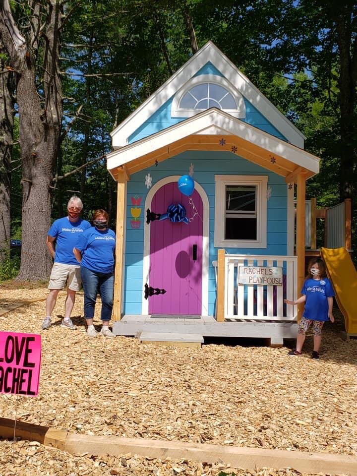 From left: Make-A-Wish volunteers Barry Peabody and Sarah Peabody pose for a photo with Rachel Flaherty outside "Rachel's Playhouse" in Waldoboro. (Photo courtesy Sonya Purington)