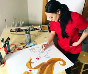 Whitefield artist Manda Hard, 33, works on her "Nurse Girl" painting, inspired by health care professionals working through COVID-19. (Photo courtesy Manda Hard)