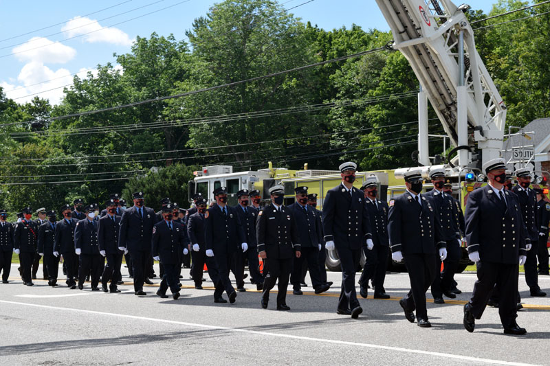 Members of the Hackensack Fire Department, of New Jersey, march in honor of firefighter Richard Kubler on Route 1 in Wiscasset, Saturday, Aug. 1. (Hailey Bryant photo)