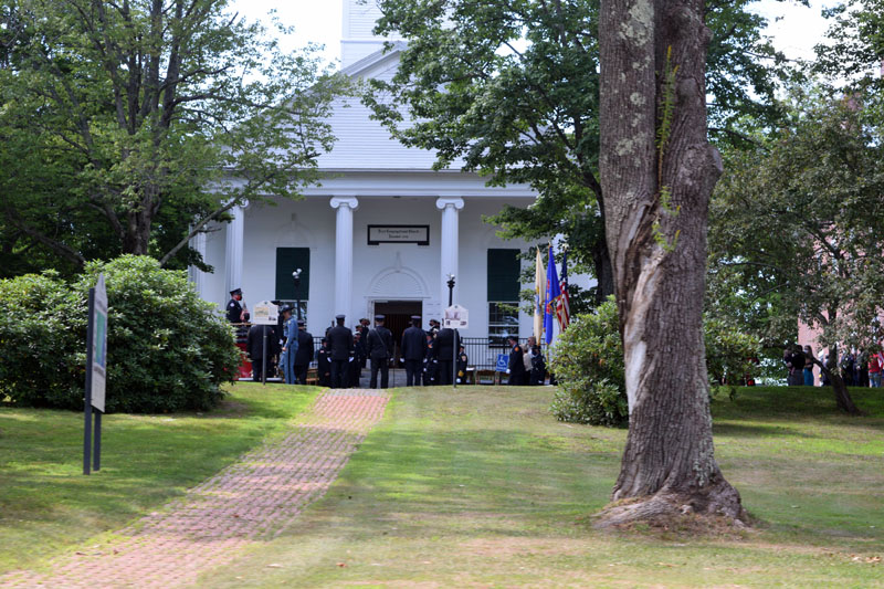 Family and friends of Richard Kubler, including many fellow firefighters, gather outside the First Congregational Church of Wiscasset, Saturday, Aug. 1. (Hailey Bryant photo)