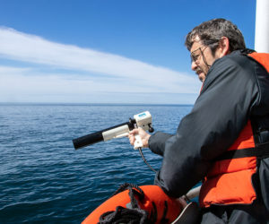 Senior research scientist Barney Balch collects ocean optics data during a research cruise in the Gulf of Maine. Balch is part of a team that has established a new approach to detect algae and measure key ocean properties using light. (Photo courtesy Bigelow Laboratory for Ocean Sciences)